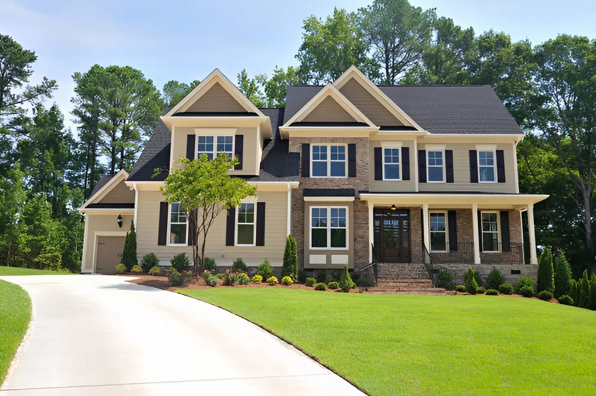 Elegant beige and stone house finished by a trusted exterior painter in Frederick, MD, showcasing timeless curb appeal