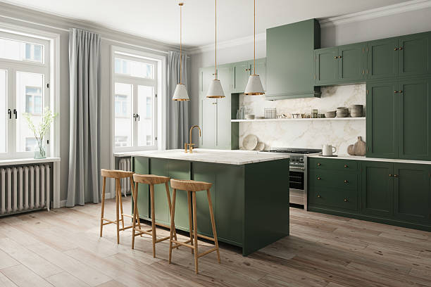 Kitchen interior painting with deep green cabinetry and soft neutral walls by a painter in Germantown, MD