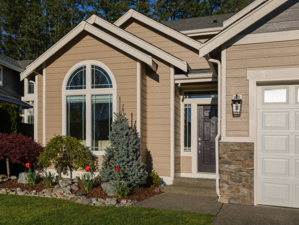 Beige home exterior with crisp white trim and detailed finish work by an exterior painter in Adamstown, MD