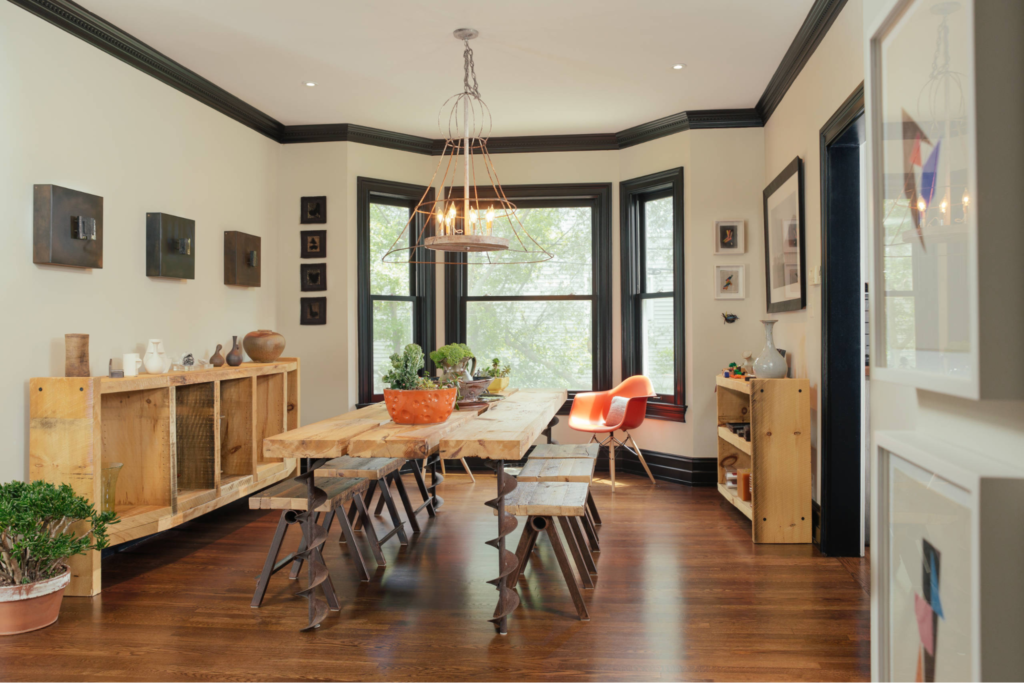 Modern dining room with painted crown molding and dark trim accents by a painting company in Middletown, MD