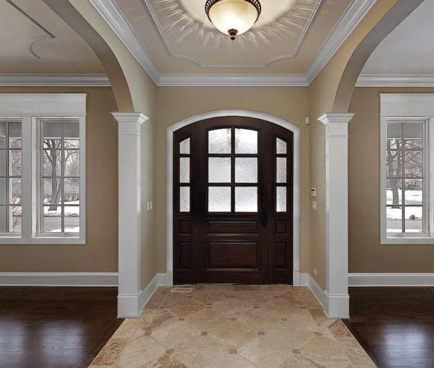 Elegant foyer with custom crown molding and decorative ceiling trim by a painting company in Middletown, MD